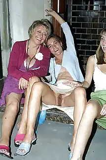 Drunk mature women sit on a step