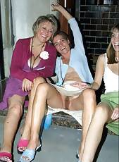 Drunk mature women sit on a step